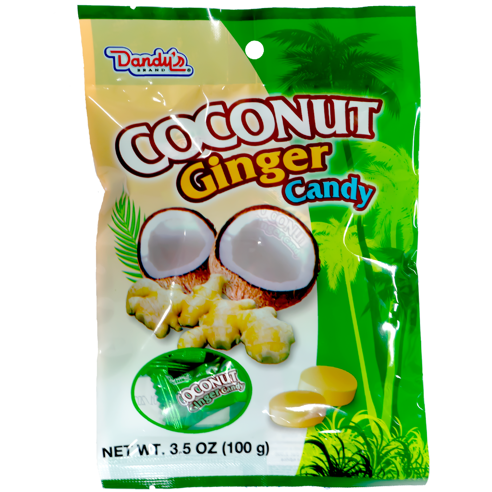 Front of the package. The packaging features an image of a halved coconut with a creamy white interior, pieces of ginger root, and yellow candy pieces. There are green palm leaves and palm trees in the background, set against a light green and beige backdrop.