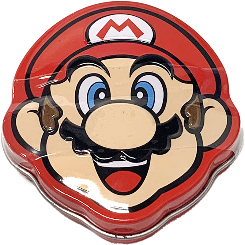 Front view of product. The tin features the cheerful face of a beloved cartoon character, with bright blue eyes and a big, welcoming smile. The iconic red cap and mustache add to the recognizable and charming design, making this tin a standout piece in any collection. The vivid colors and playful expression capture the essence of fun and excitement.