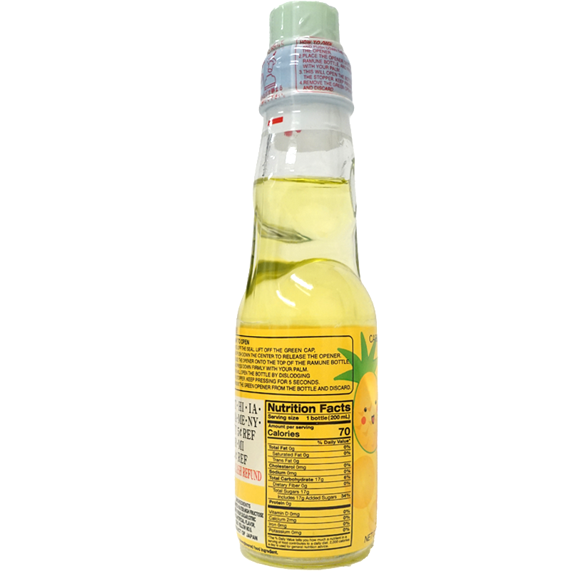 Glass bottle of yellow-colored beverage with label, nutrition facts visible, and sealed cap.