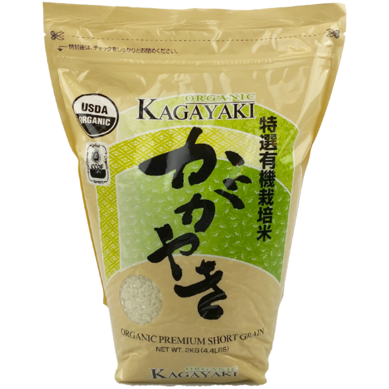 The package features a clean, sophisticated design with a beige and green color scheme, emphasizing its organic nature. The prominent Japanese characters and clear window showcasing the rice grains convey authenticity and quality.