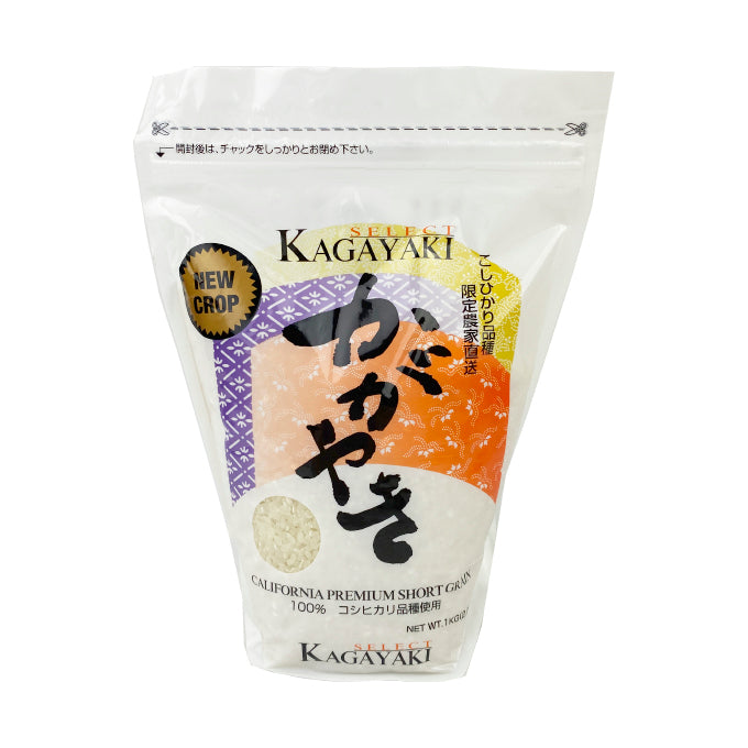 The packaging features a clean and modern design with a prominent display of Japanese calligraphy. The front of the bag showcases the high-quality short grain rice with an appealing graphic of rice grains. The back includes detailed cooking instructions and a friendly character illustration, adding a touch of charm.