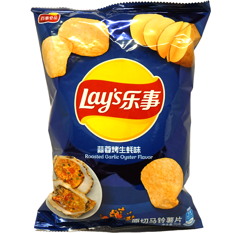 Front view of package. The packaging features a deep blue background with vibrant images of the chips and a delicious roasted garlic oyster dish. The enticing visuals highlight the savory and exotic flavor profile, making the bag an eye-catching addition to any snack aisle.