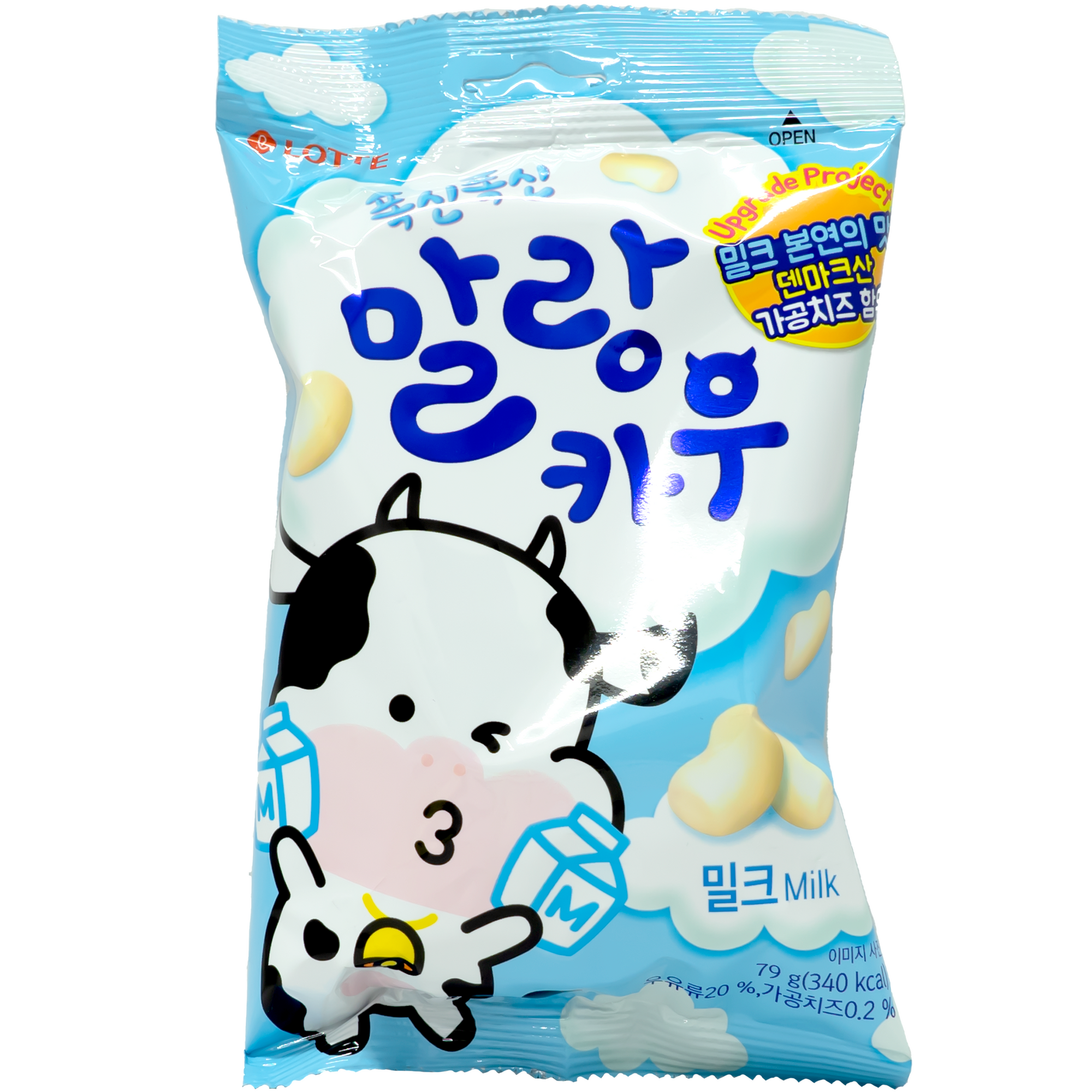 Front view of package. The package features a playful cartoon cow and calf, both holding milk cartons. The background is a cheerful blue sky with fluffy white clouds, enhancing the whimsical and fun design. The candies are depicted as soft, pillow-like treats, adding to the appeal.